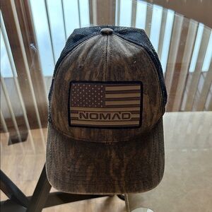 Nomad snap back American flag camo hat.